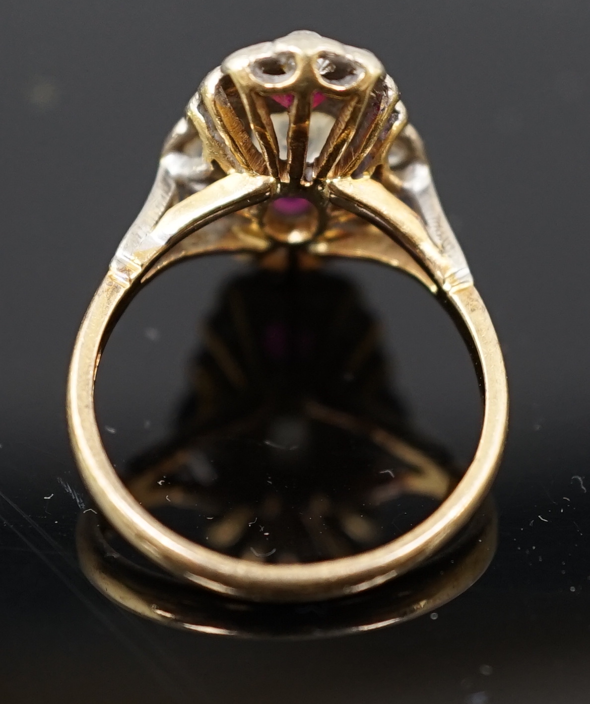 An 18ct gold ruby and diamond cluster ring